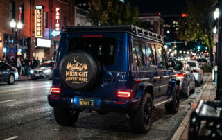 Custom vinyl tire cover on the back of a vehicle